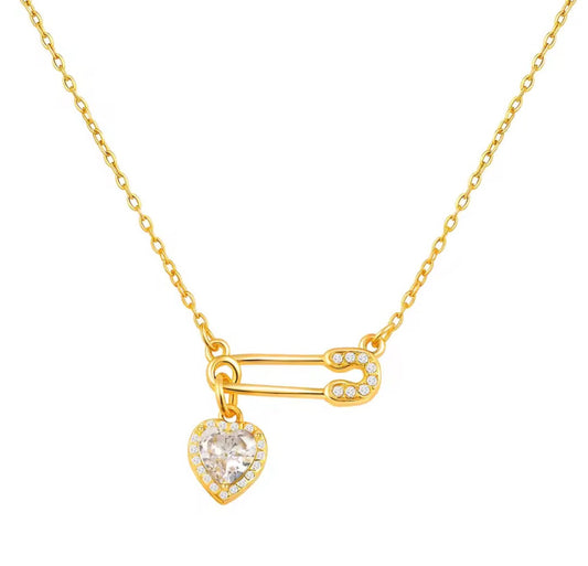 Loulu sparkling heart safety pin necklace.